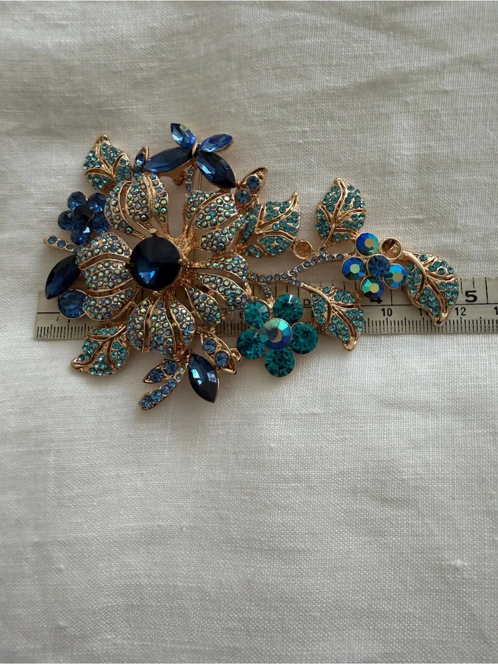 Gold-Tone Floral Crystal Brooch in Blue and Teal